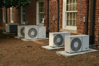 photo of five hvac units outside of a brick building