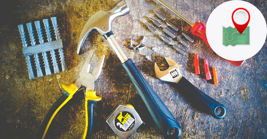 image of construction tools on a well worn bench