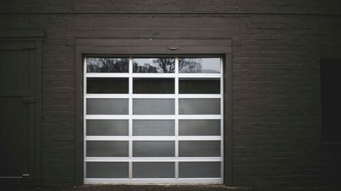 image of an overhead garage door in a brown painted exterior wall